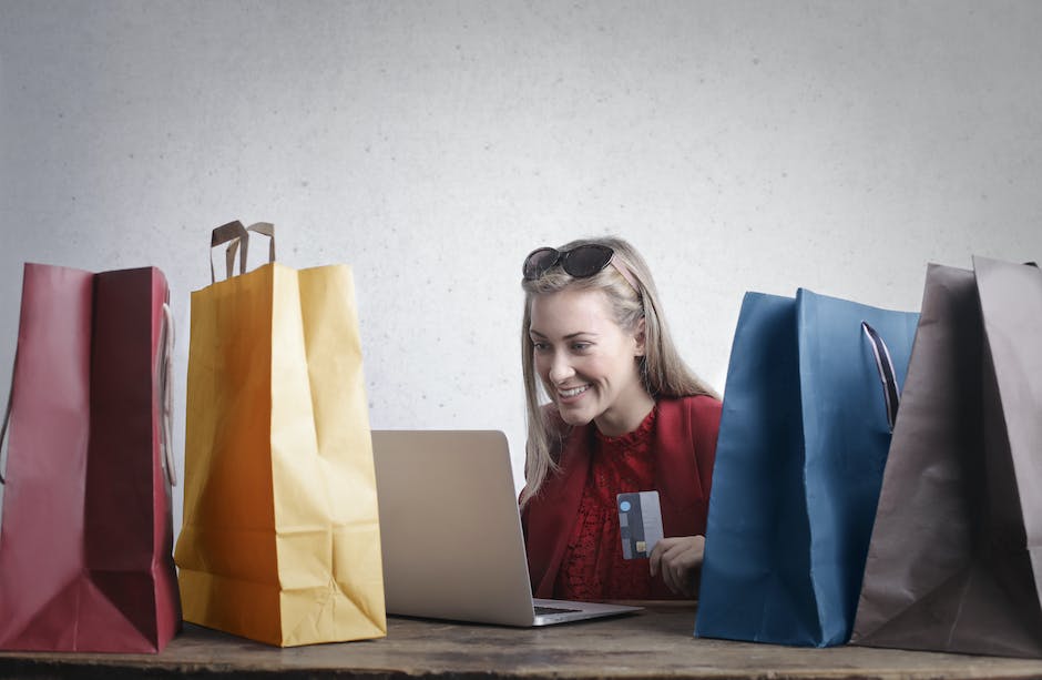 Illustration of a person using a laptop and shopping online.