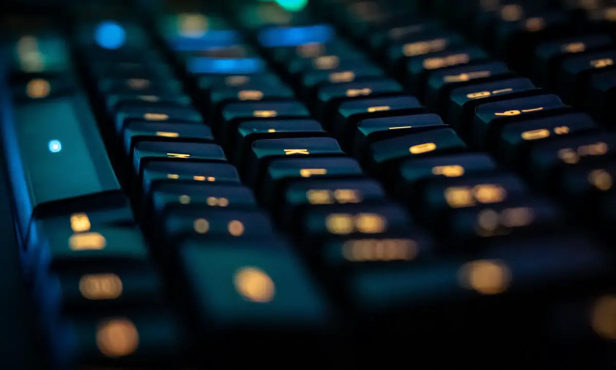 A person typing on a keyboard with the words 'AI Content Creation' written on the screen.