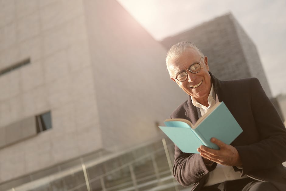 Image depicting the clarification of information use, showing a person reading a document with a magnifying glass