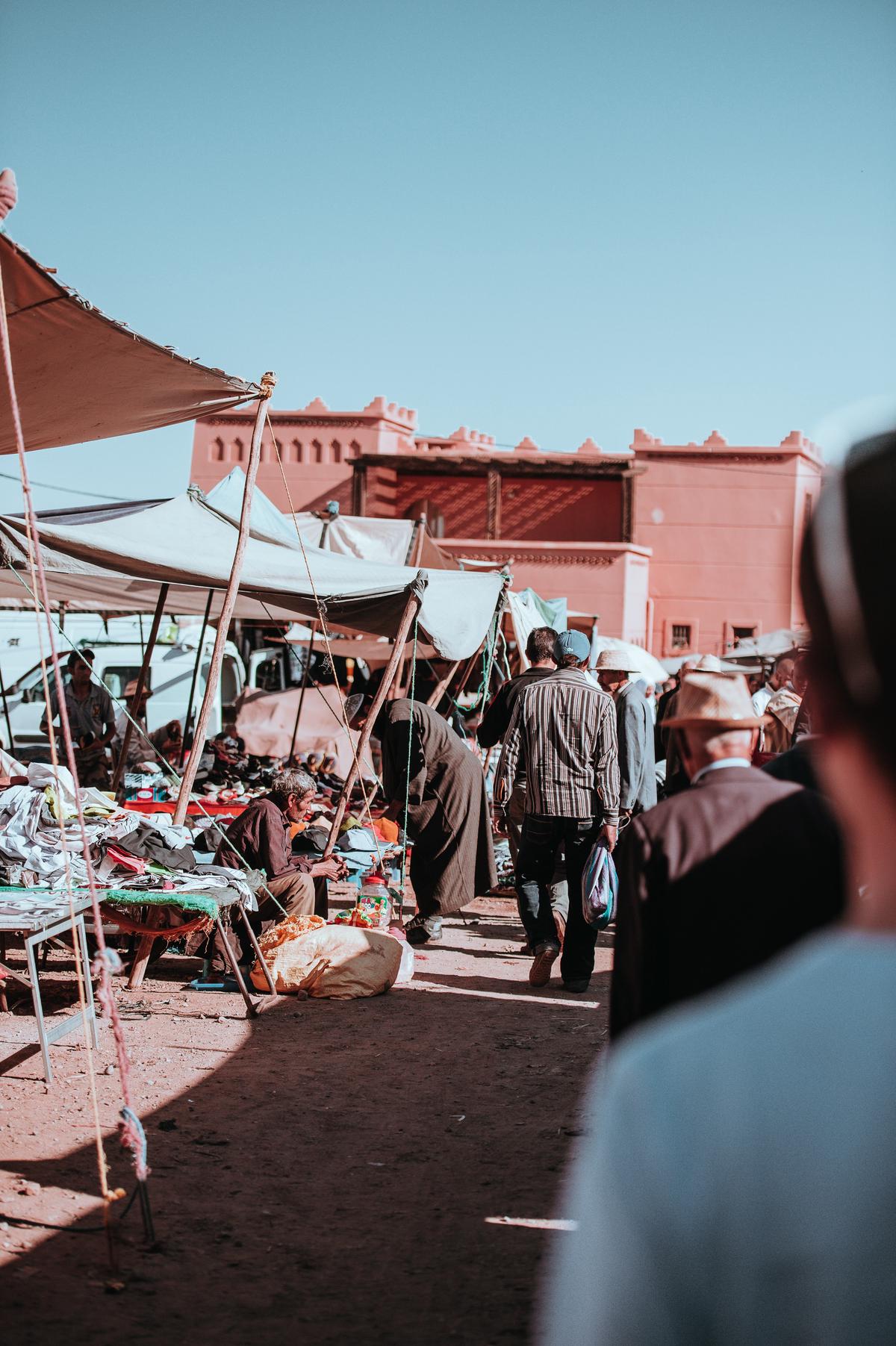 An image showing a person conducting market research by observing people and analyzing data.