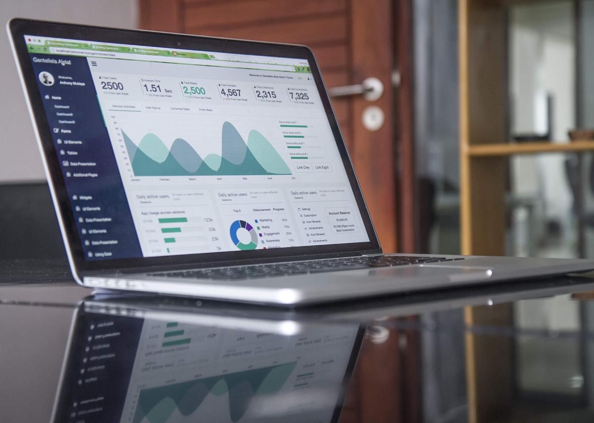 Illustration of a magnifying glass with charts and graphs representing SEO metrics.