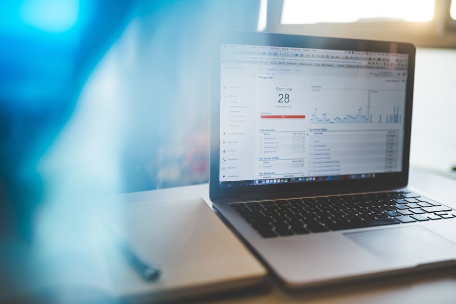 A desk setup with multiple screens displaying SEO analytics and keyword research tools
