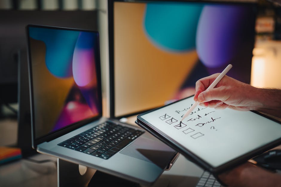 A hand holding a tablet with a digital checklist for website maintenance tasks