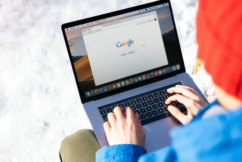 A person typing on a laptop, managing a website